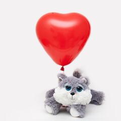 Red heart-shaped balloon mock-up with a toy cat