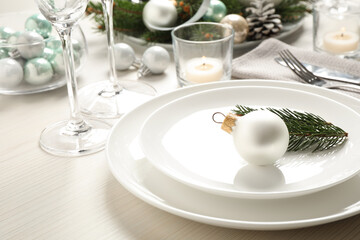 Fototapeta na wymiar Festive table setting with beautiful dishware and Christmas decor on white wooden background