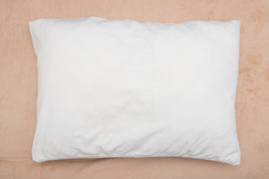 White mock up pillow on beige background