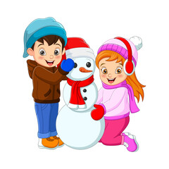 Happy boy and girl playing with a snowman