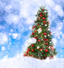 Fototapeta na wymiar Beautiful decorated Christmas tree and snow on blue background. Bokeh effect