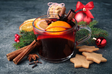 Christmas composition with aromatic mulled wine on grey table