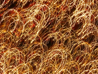 Rounded stripes light painting - photo of many led lamps with long exposure and movement at dark night