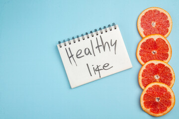 top view fresh grapefruits lined on blue background citrus fresh juice color photo fruits
