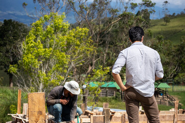 worker and architect on a site