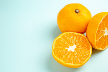 front view fresh tangerine slices on light-blue background fruit color orange photo citrus