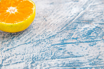 front view fresh tangerine slice on light-blue background citrus juice color fruits