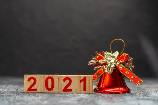 front view writing with bell on dark background photo color new year christmas