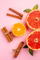 top view tasty grapefruits fruit slices with cinnamon on a pink background mellow color diet citrus fresh juice fruit