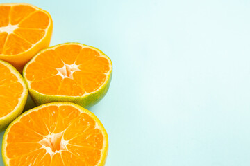 front view fresh tangerine slices on light-blue background photo fruit color juice citrus orange