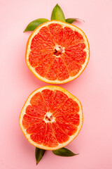 top view tasty grapefruits fruit slices on a pink background mellow fresh fruit juice color diet citrus