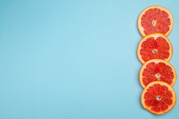 top view fresh grapefruits lined on blue background citrus fresh juice color photo fruit
