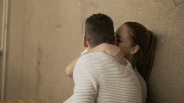 Teen couple hugging in the high school