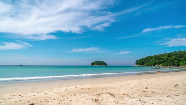 4k timelapse of small island in tropical andaman sea,beautiful tropical island in Phuket. Thailand under a clear blue sunny sky in summer season,Landscape beach and small wave in summer day