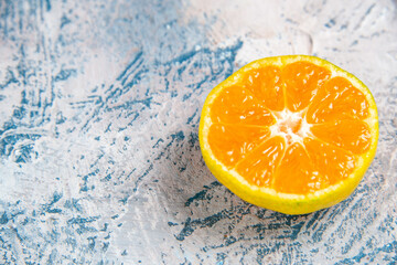 front view fresh tangerine slice on a light-blue background citrus photo juice color fruit