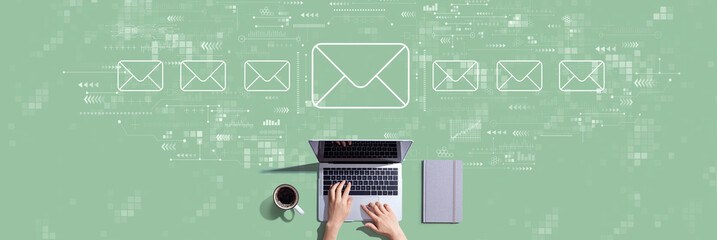 Email concept with person working with a laptop