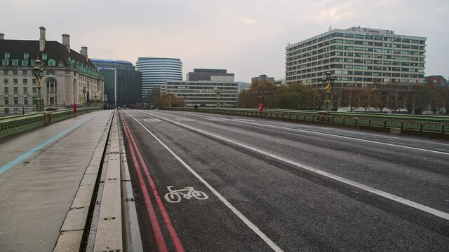 Coronavirus Covid-19 lockdown in London with empty streets and quiet deserted roads and streets at Westminster Bridge with no cars or traffic, an unusual bizarre sight in London, England, UK