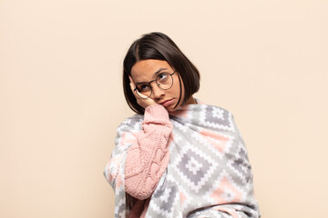 young latin woman feeling bored, frustrated and sleepy after a tiresome, dull and tedious task,...