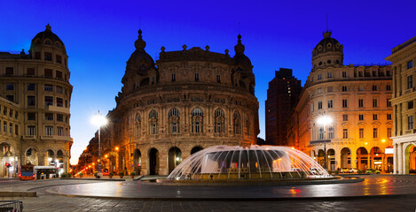 Fototapeta na wymiar Night light of The Ferrari Square with fountain in Genoa of Italy outdoor.