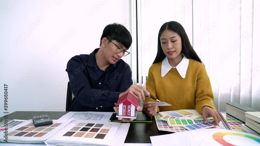 Poster team designer working graphic with color chart on new project with work tools and equipment at workp