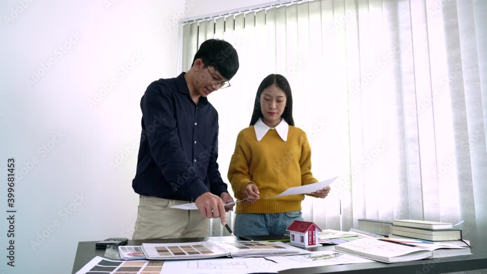 Poster team designer working graphic with color chart on new project with work tools and equipment at workp