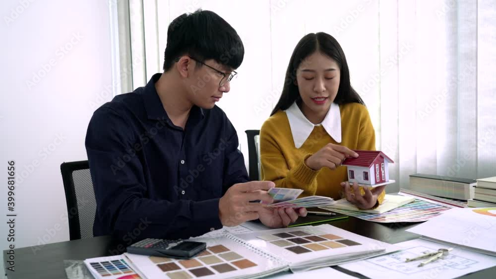 Poster team designer working graphic with color chart on new project with work tools and equipment at workp