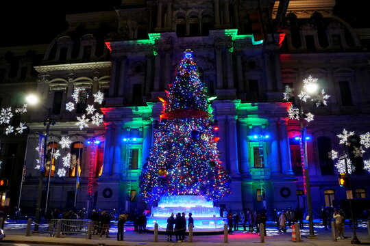 Philadelphia, Pennsylvania, U.S - December 23, 2018 - A large Christmas tree and colorful lights display in front of the City Hall