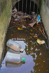 Waste from the garbage in the storm drain