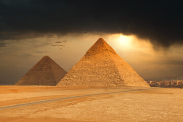 Fototapeta na wymiar The Famous Pyramids At Giza In Egypt With A Dramatic Sky
