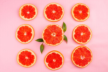 top view tasty grapefruits sliced juicy fruits lined on pink background healthy life juice fresh color diet fruits