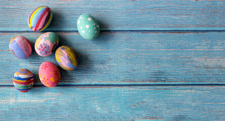 Colorful Easter eggs on table. Easter festive holidays concept.