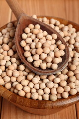 Whole yellow peas in wooden bowl