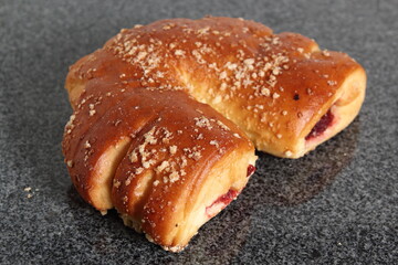 Crescent shaped sweet roll with jam