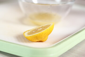 Slice of lemon and bowl with lemon juice. Making Apple Tarte Tatin with Cinnamon Series.