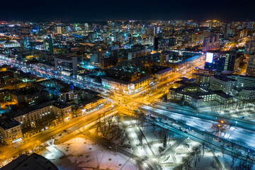 Obraz na płótnie Canvas Aerial view of the night modern city. Bright lights of the night streets. Ekaterinburg. Russia