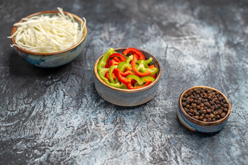 front view sliced cabbage with bell-peppers on light-grey background diet ripe salad fopod health photo