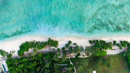 Tropical island with sandy beach, crystal water ocean, aerial view. Gili Islands, Lombok, Indonesia