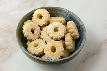 Ceramic snack bowl full of Italian canestrellini shortbread cookies in table