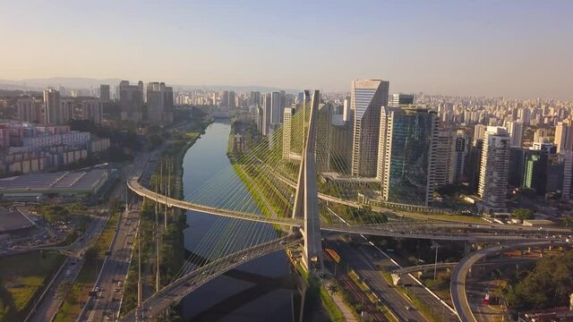 flight over estaiada bridge in S&atilde;o Paulo, over Pinheiros river at sunset