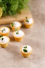 Canapes with light cream filling. Still life with microgreens. The concept of an appetizing snack.