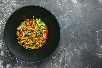 top view delicious vegetable salad inside plate on grey background color photo meal health food free space