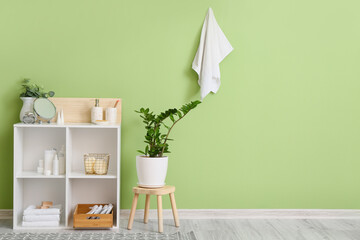 Interior of modern bathroom with cosmetic supplies