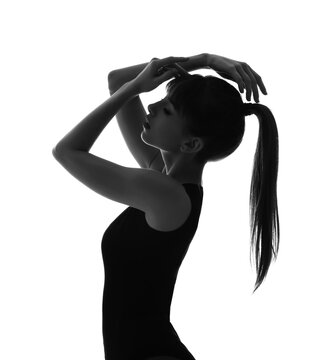 Silhouette of beautiful young woman on white background