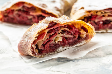 cherry strudel with walnut, Traditional Austrian cuisine, close up. white background