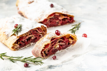 dessert of cherry strudel with cranberry, rosemary on white background, Traditional Austrian cuisine
