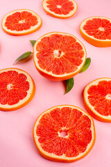 front view tasty grapefruits sliced juicy fruits lined on a pink background healthy life juice fresh color diet