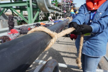 High voltage cable line or large electric cable and pulley block which is on scaffolding the high ground in chemical plants, power plants, oil and gas industry or onshore.