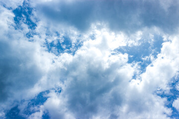 Blue sky and white clouds in day time.