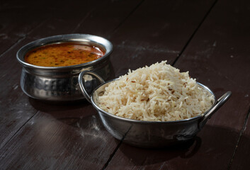 Indian Cuisine Jeera Rice With Dal Tadka Also Know As Cumin Rice on Vintage Wooden Background