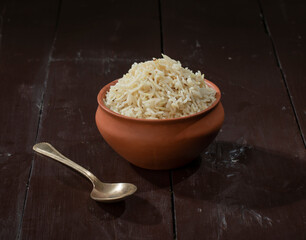Indian Cumin Rice or Jeera Rice on Wooden Background